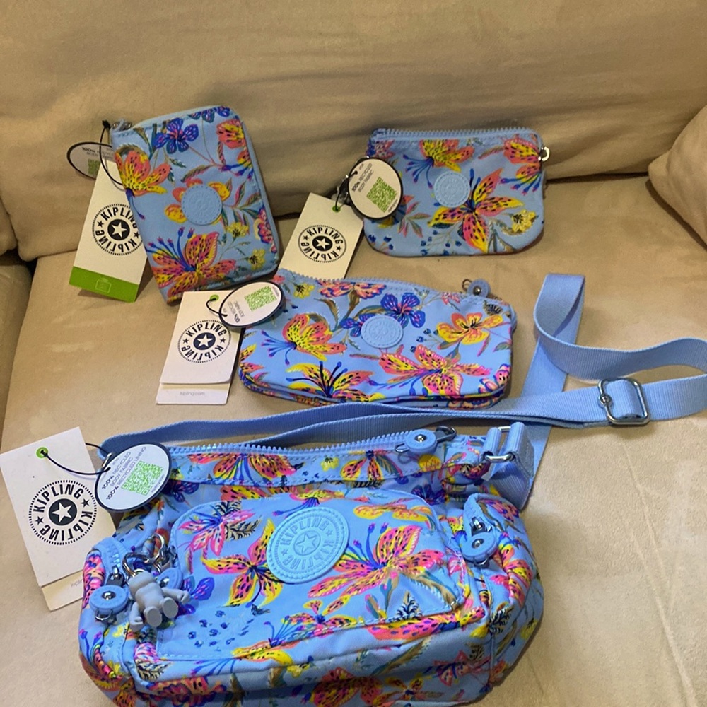 Kipling 4 pc set in Wild Flowers includes purse, wallet and two multi pocket